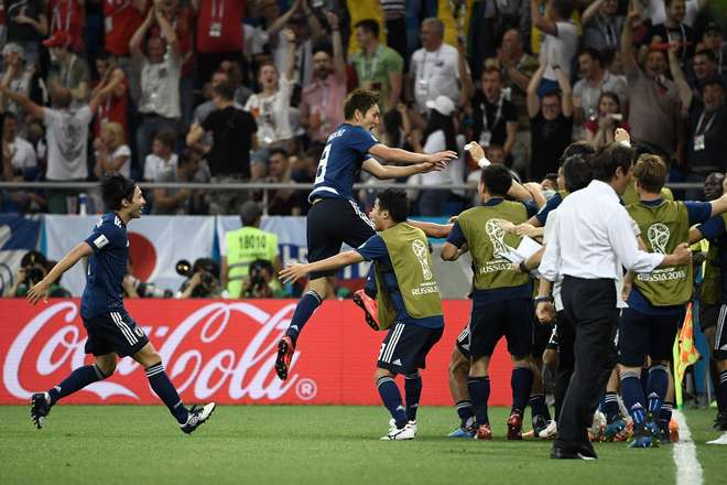 Genki Haraguchi pula para celebrar o gol do Japão - FILIPPO MONTEFORTE / AFP